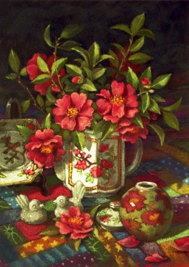 Red camelias spill out of a decorated teapot