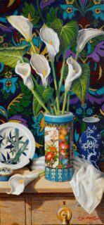 Tall Arum lillies in a highly - decorated vase.