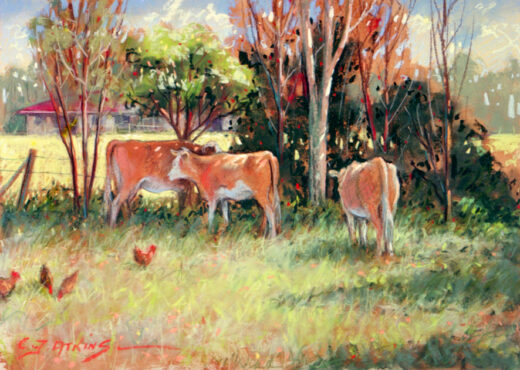 Three cows are at rest near a fence, a house is in the background.