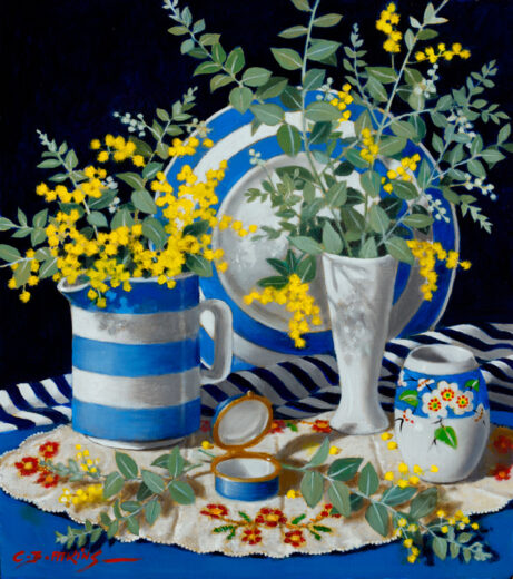 Light blue and white striped ceramics are arranged with a dark blue and white striped cloth.